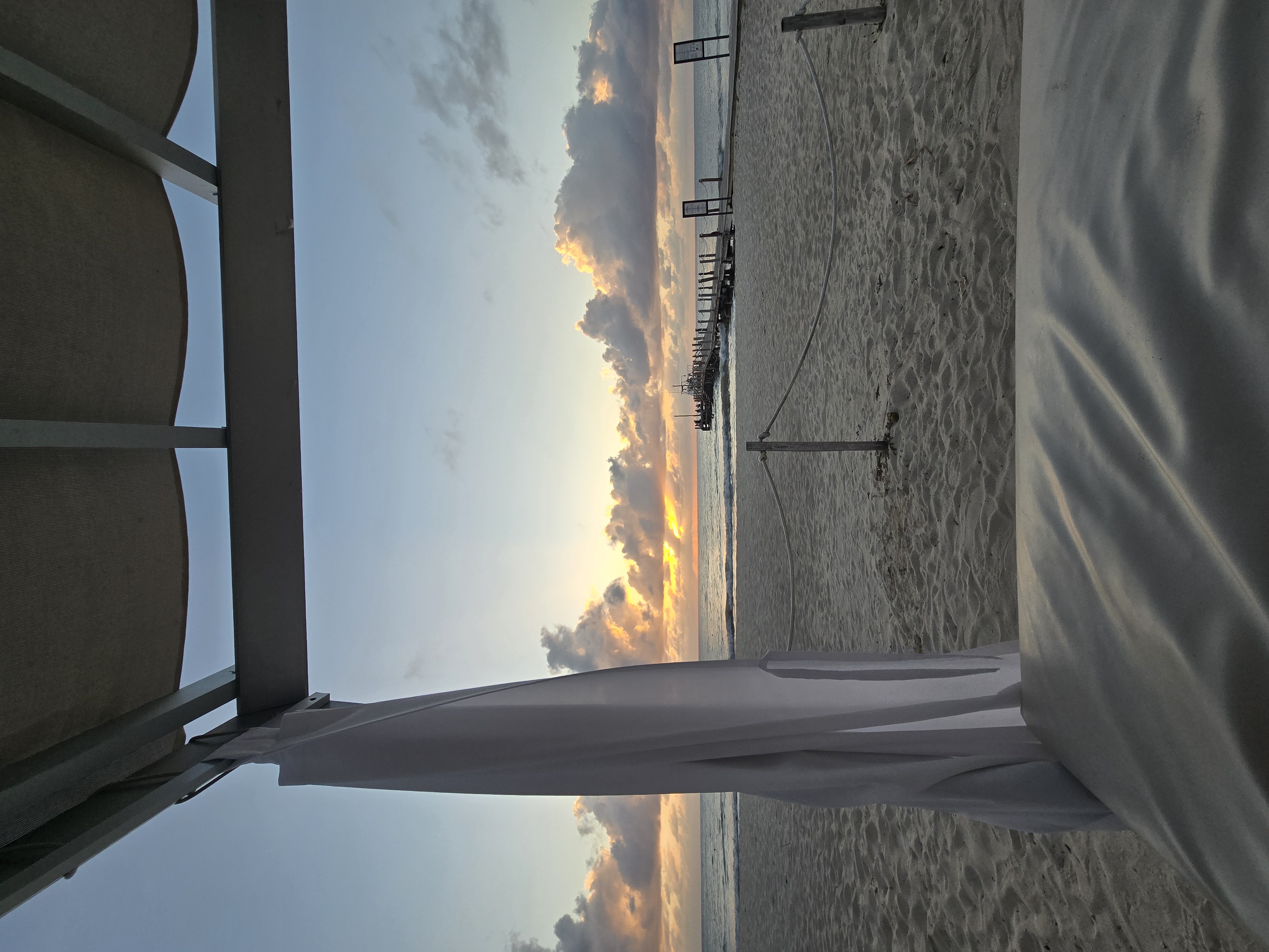 Relaxing on a beach bed at sunset at the Cozumel resort