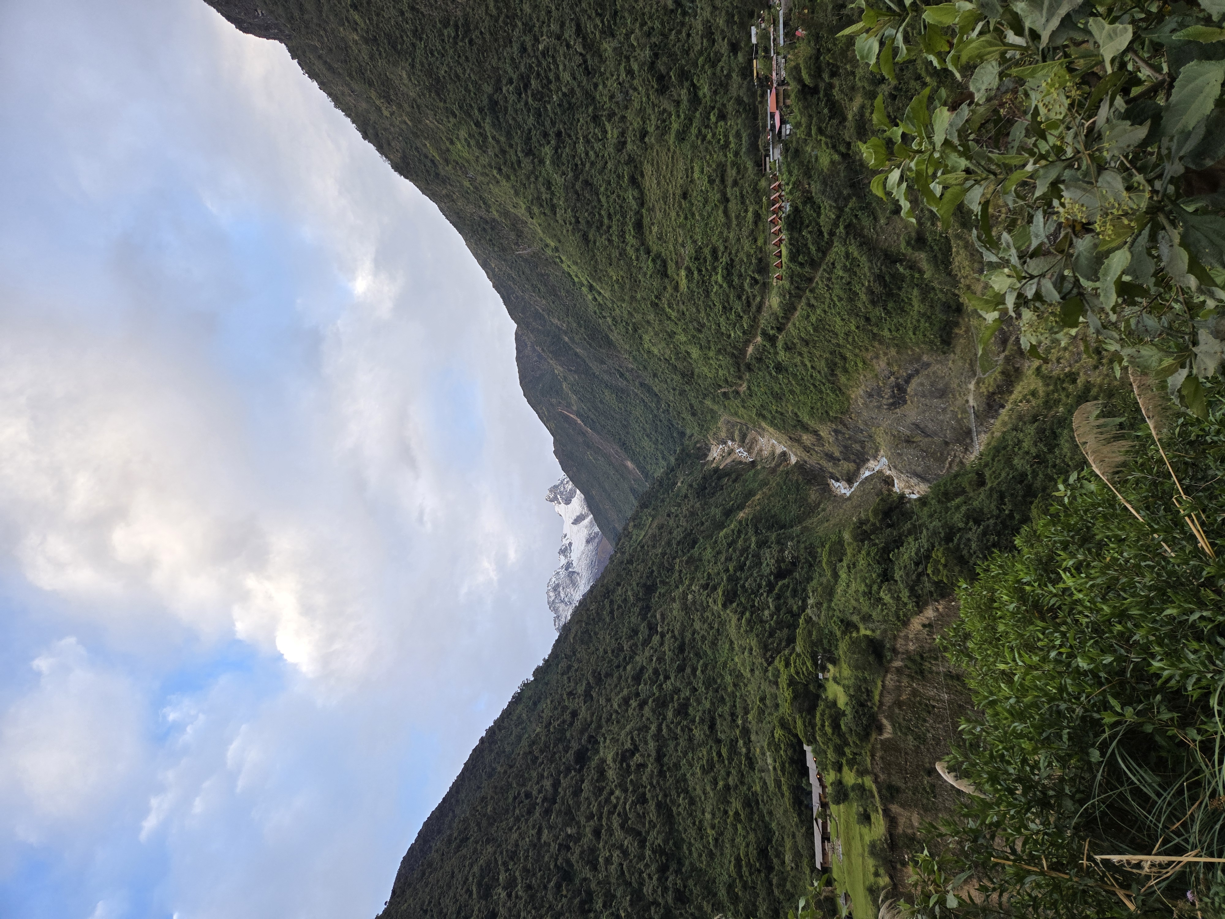 Descending from Salkantay Pass along a rocky mountain trail