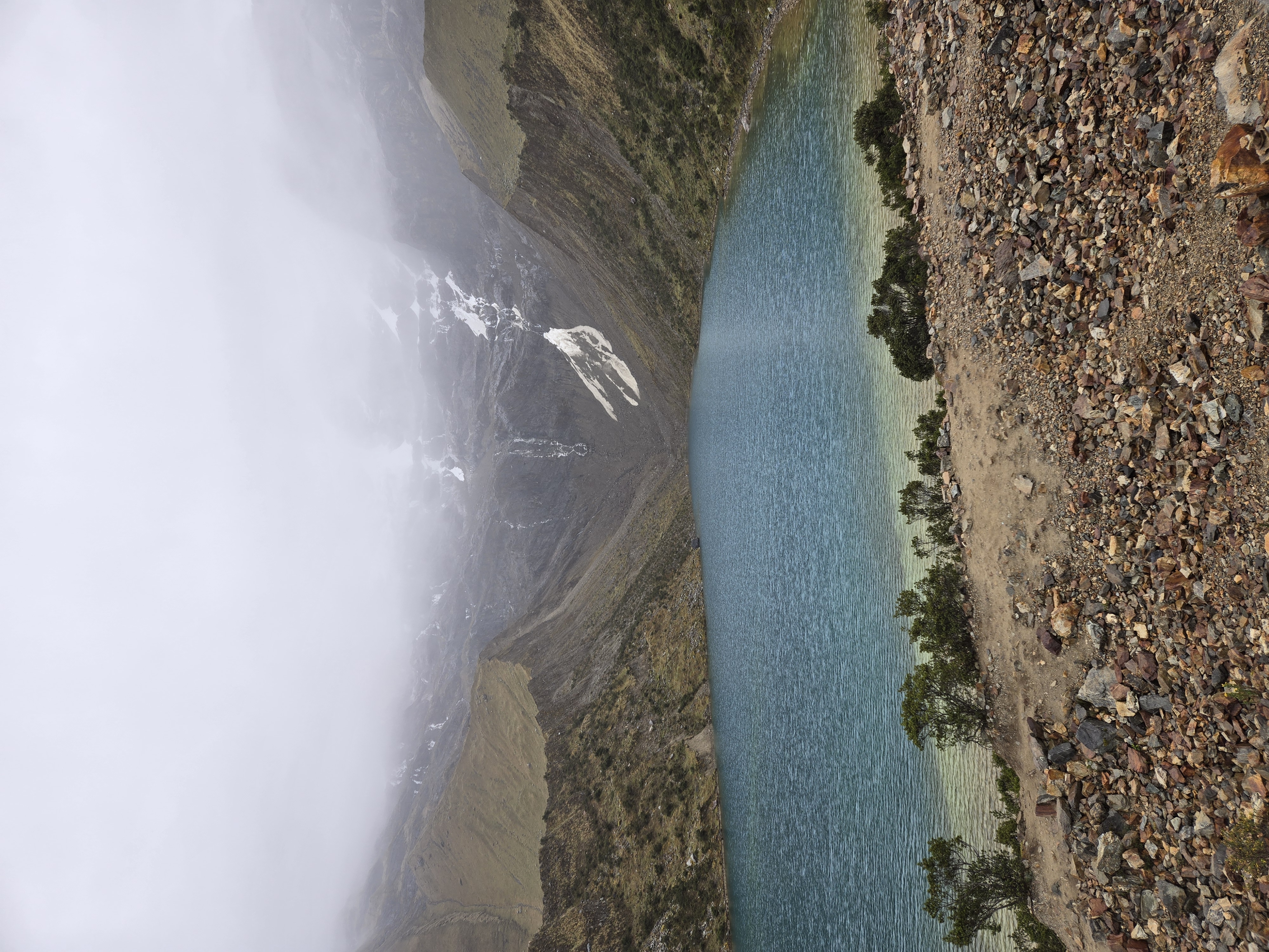 Turquoise water at Humantay Lake beneath glaciated mountains