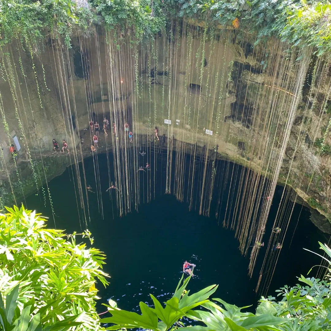 Water and limestone walls inside Cenote Ik Kil